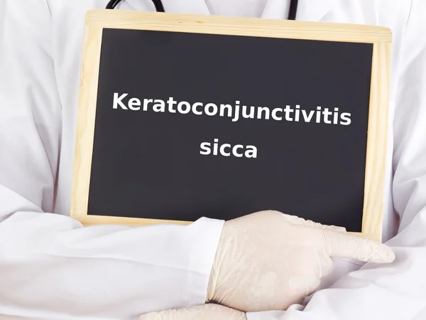 Le médecin montre des informations : kératoconjonctivite sicca — Photo