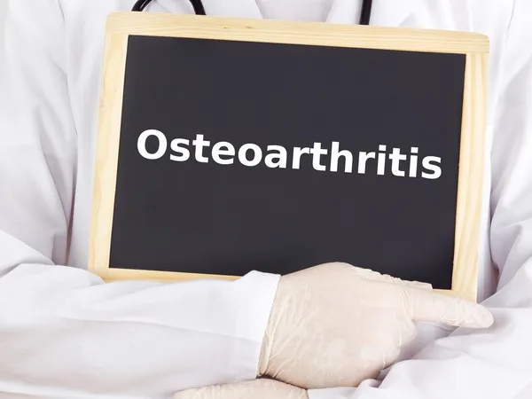 Doctor shows information: osteoarthritis — Stock Photo, Image