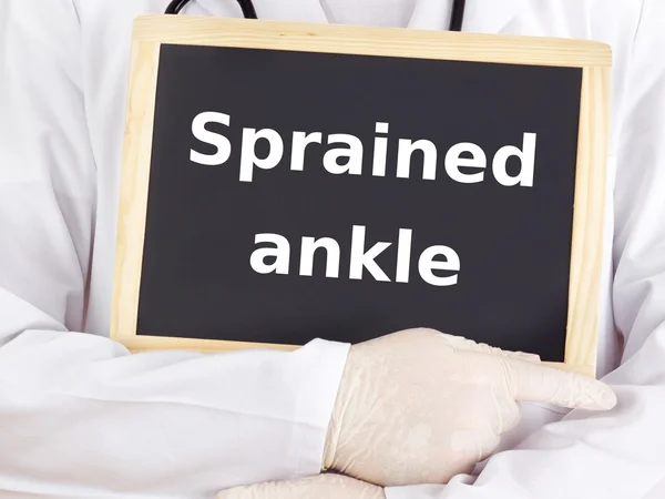 Doctor shows information: sprained ankle — Stock Photo, Image