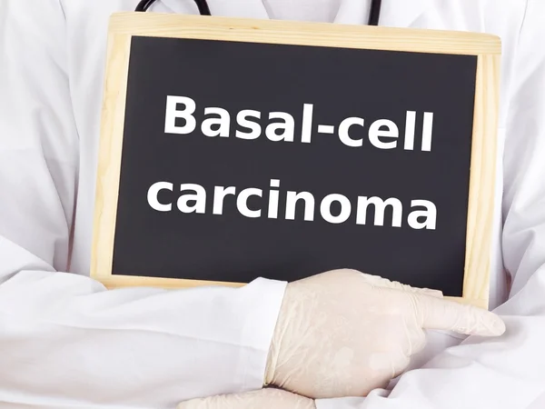 Doctor shows information: basal-cell carcinoma — Stock Photo, Image