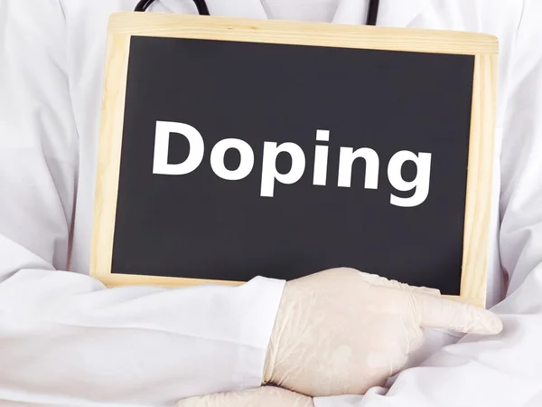 Doctor shows information on blackboard: doping — Stock Photo, Image