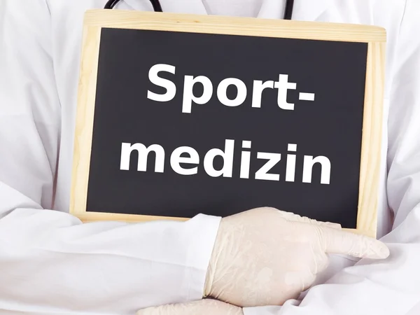 Doctor shows information: sport medicine — Stock Photo, Image