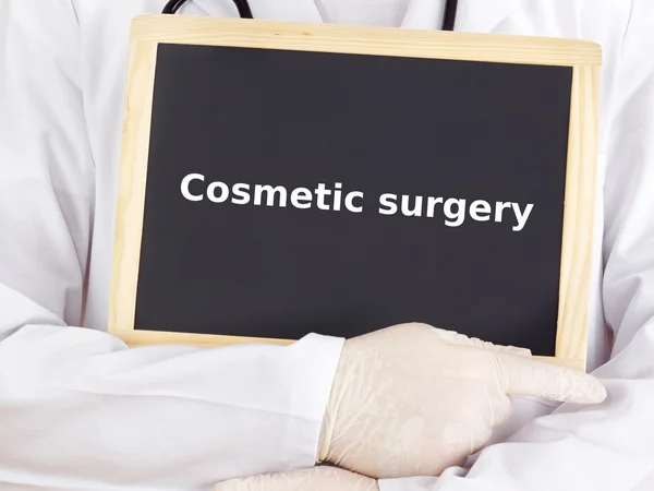 Doctor shows information: cosmetic surgery — Stock Photo, Image