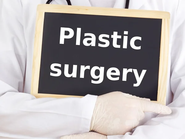 Doctor shows information: plastic surgery — Stock Photo, Image