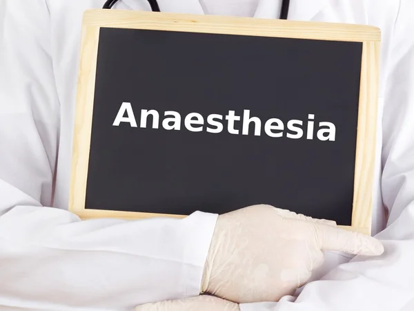 Doctor shows information on blackboard: anaesthesia — Stock Photo, Image