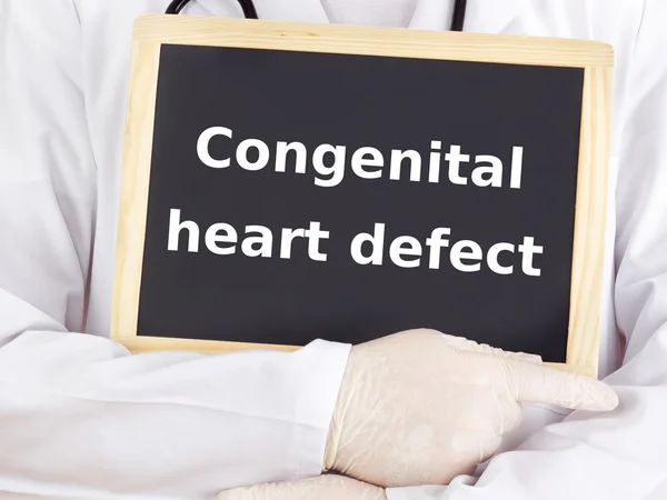 Doctor shows information: congenital heart defect — Stock Photo, Image