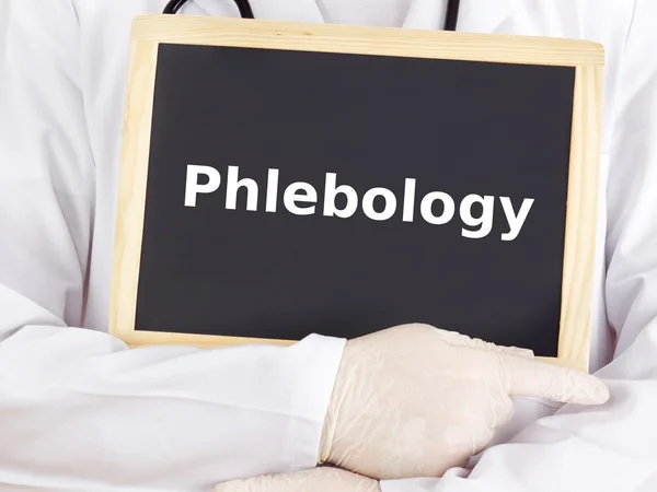 Doctor shows information on blackboard: phlebology — Stock Photo, Image