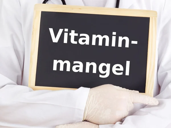 Doktor bilgileri gösterir: vitamin eksikliği — Stok fotoğraf