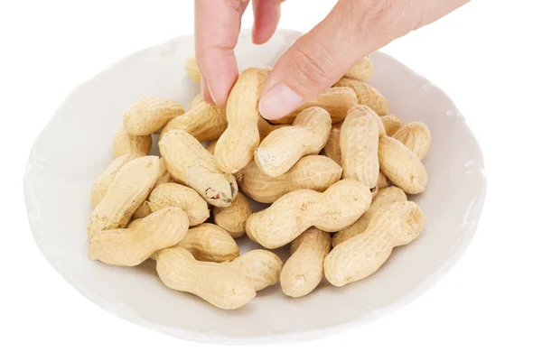 Person eating peanuts — Stock Photo, Image