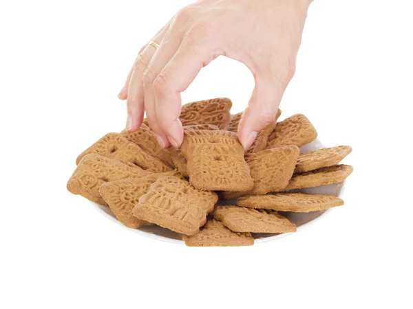 Person eating delicate speculoos — Stock Photo, Image