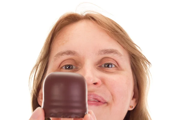 Woman with chocolate marshmallow in the face — Stock Photo, Image