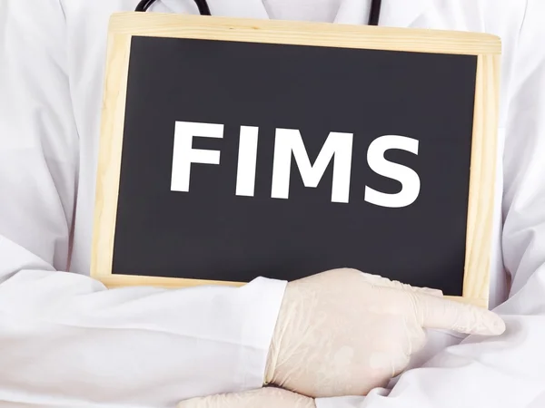 Doctor shows information on blackboard: FIMS — Stock Photo, Image