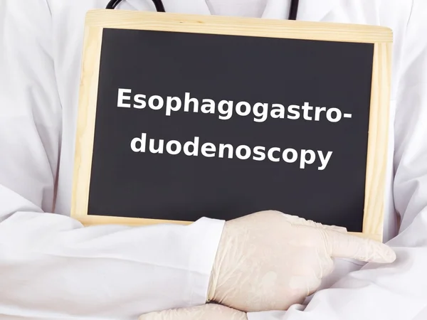 Doctor shows information: esophagogastroduodenoscopy — Stock Photo, Image