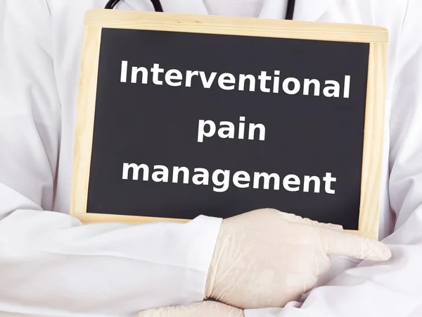 Doctor shows information: interventional pain management — Stock Photo, Image