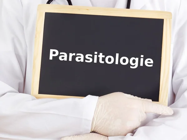 Doctor shows information on blackboard: parasitology — Stock Photo, Image