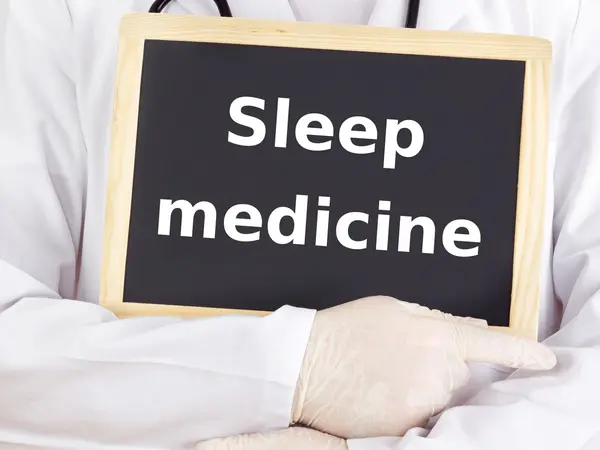 Doctor shows information on blackboard: sleep medicine — Stock Photo, Image