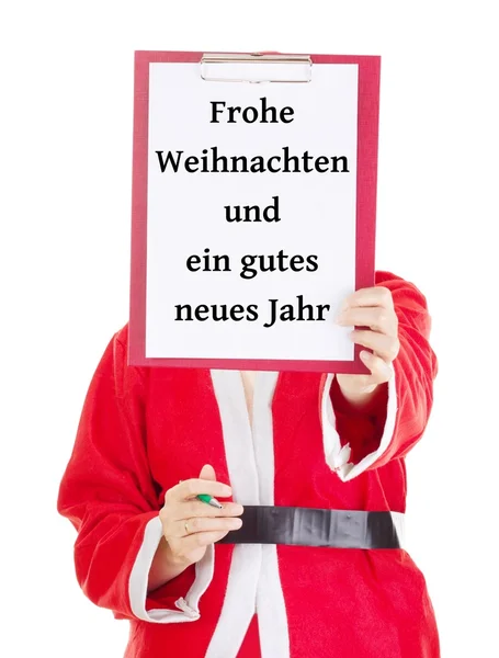 Weihnachtsmann zeigt etwas auf Klemmbrett — Stockfoto