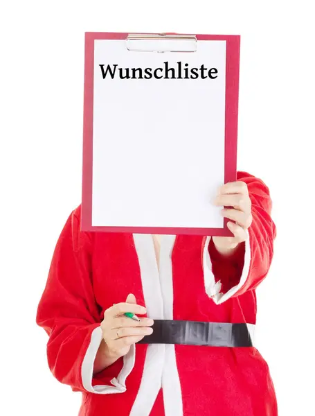 Weihnachtsmann zeigt etwas auf Klemmbrett — Stockfoto