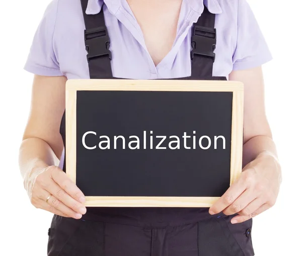 Craftsperson with blackboard: canalization — Stock Photo, Image