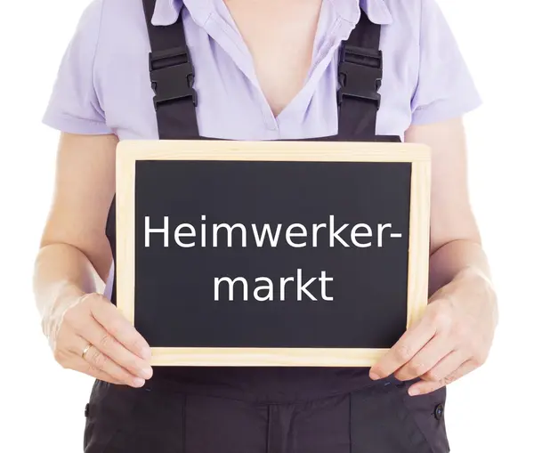 Craftsperson met schoolbord: doe-het-winkel — Stockfoto