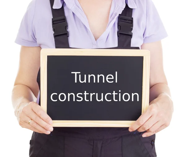 Craftsperson with blackboard: tunnel construction — Stock Photo, Image