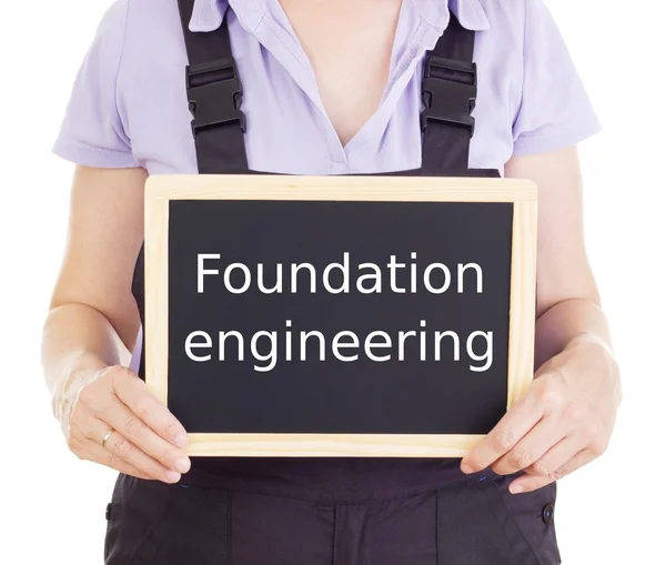 Craftsperson with blackboard: foundation engineering — Stock Photo, Image