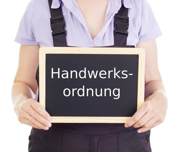 Craftsperson with blackboard: trade and crafts code of germany — Stock Photo, Image