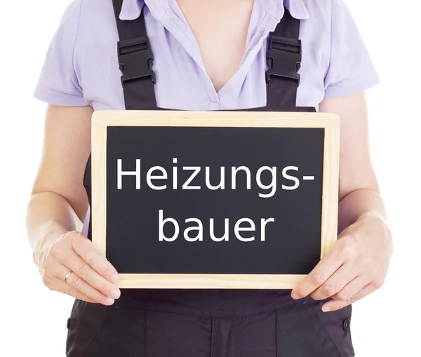 Handwerker mit Tafel: Heizungsinstallateur — Stockfoto