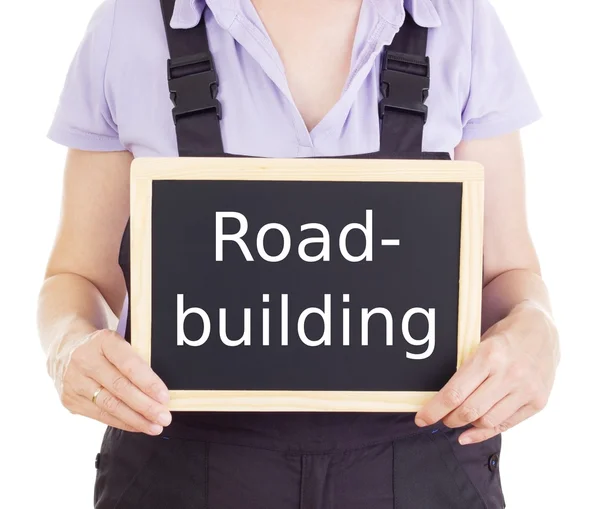 Craftsperson with blackboard: road-building — Stock Photo, Image