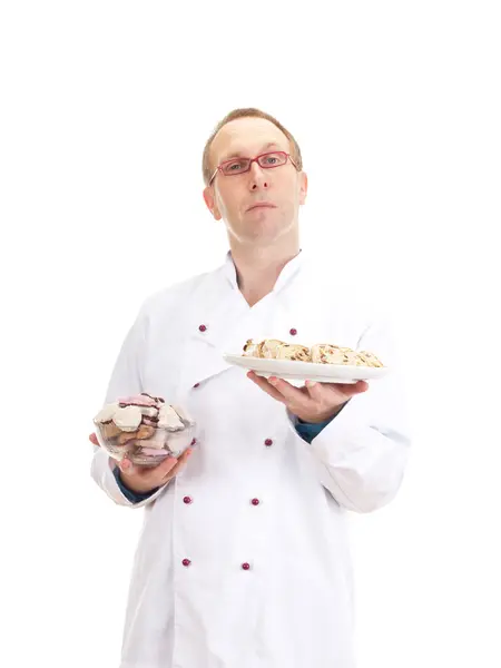 Baker with gingerbreads and stollen — Stock Photo, Image