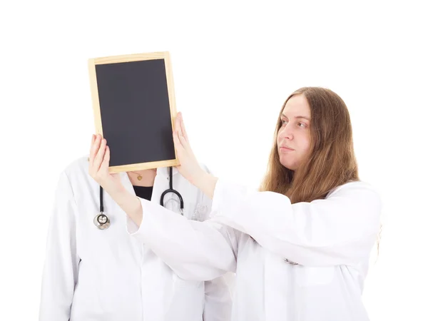 Two female medical doctors with blackboard — Stock Photo, Image