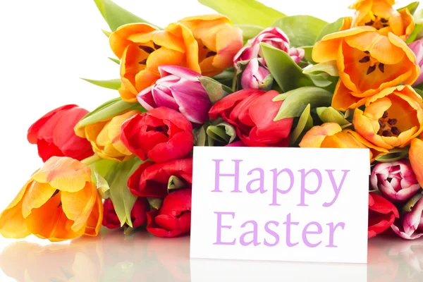 Bunch of tulips with card: happy easter — Stock Photo, Image