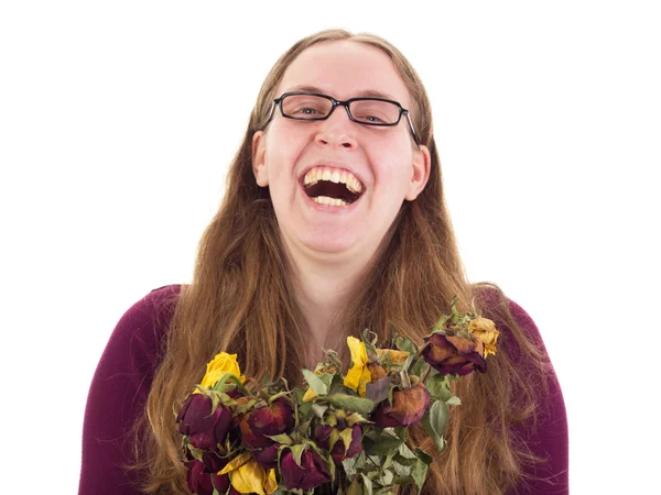 Žena, směje se sušenými růžemi — Stock fotografie