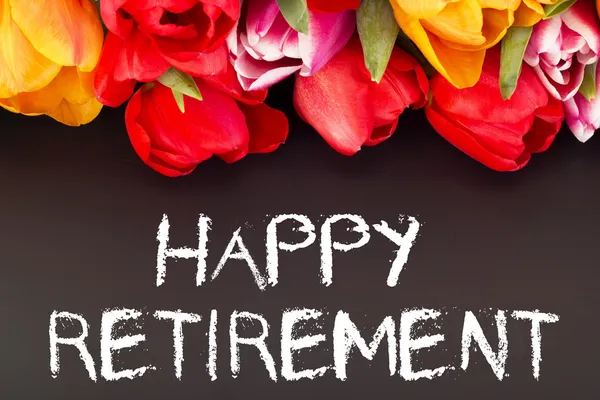 Tulpenstrauß mit Tafel: Glücklicher Ruhestand lizenzfreie Stockfotos