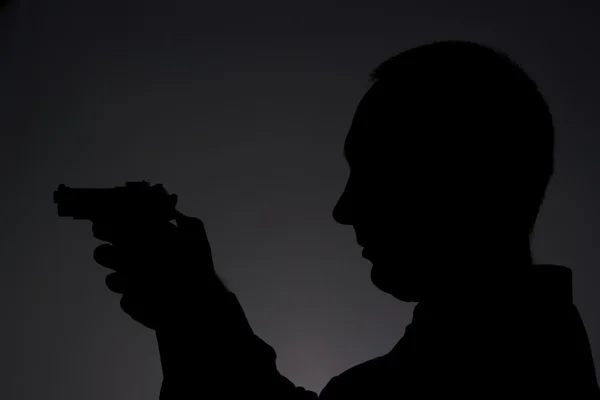 Hombre con arma — Foto de Stock