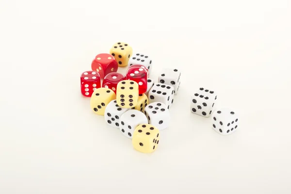 A lot of dice on the table — Stock Photo, Image