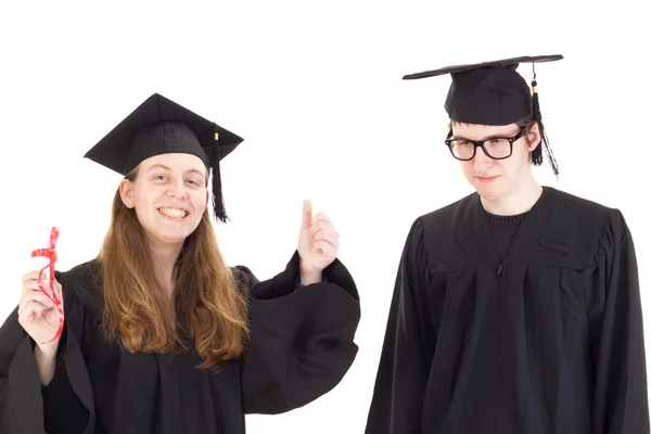 Two graduates in their academic gowns — Stock Photo, Image