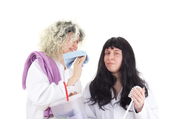 Female cleaners in white work coats — Stock Photo, Image