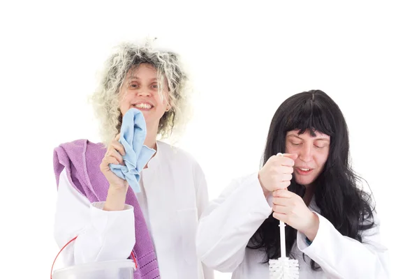 Vrouwelijke schoonmakers in witte werk jassen — Stockfoto