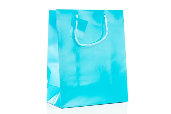 Single blue shopping bag on white background — Stockfoto