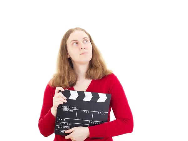 Young woman with clapperboard thinking about something — Stock Photo, Image