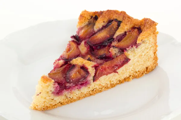 Slice of cake with sweet plums — Stock Photo, Image