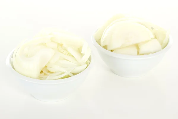 Cutted onions in white bowls — Stock Photo, Image