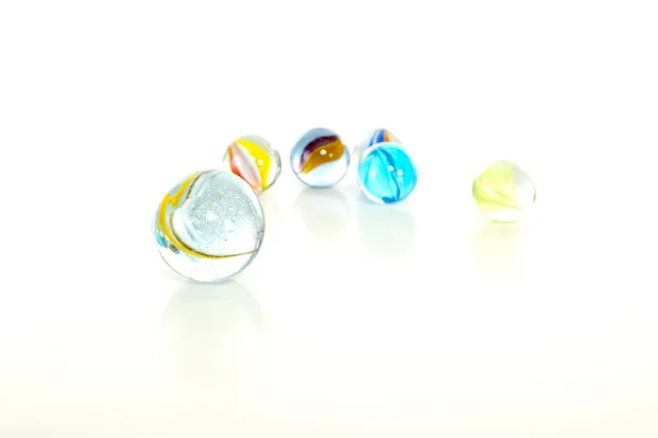Colourful marbles on white background — Stock Photo, Image