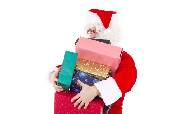 Weihnachtsmann trägt zu viele bunte Geschenke — Stockfoto