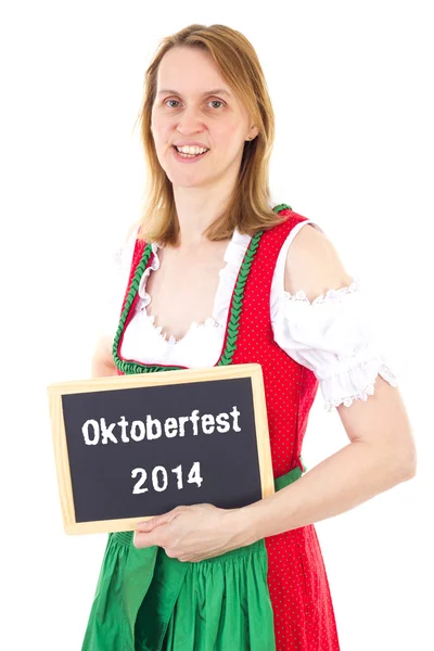 Mujer en dirndl muestra pizarra: Oktoberfest 2014 — Foto de Stock