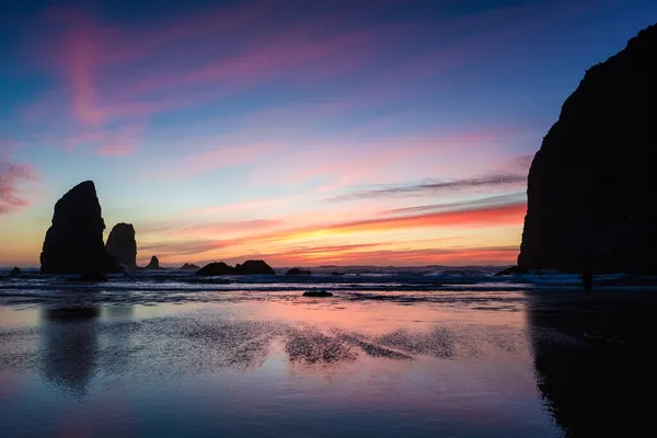 Oregon sunset between the needles and the haystack at cannon bea