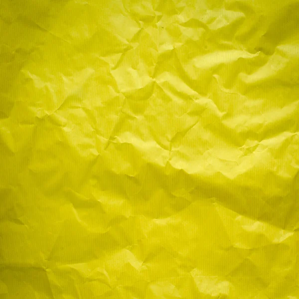 Yellow Crumpled paper background — Stock Photo © Jayjaynaenae
