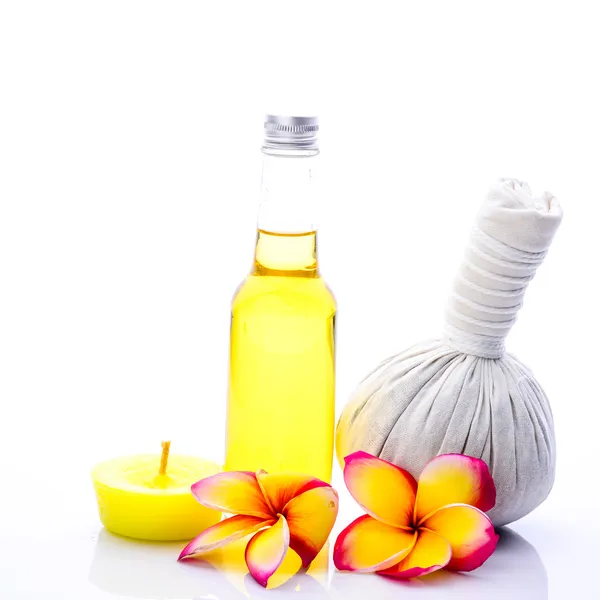 Herbal compress ball and massage oil for spa treatment — Stock Photo, Image