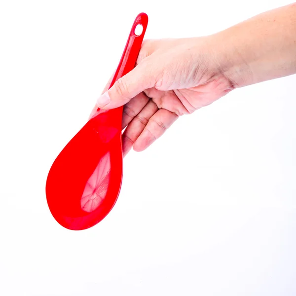 Hand holding red -ladle isolated on white background — Stock Photo, Image